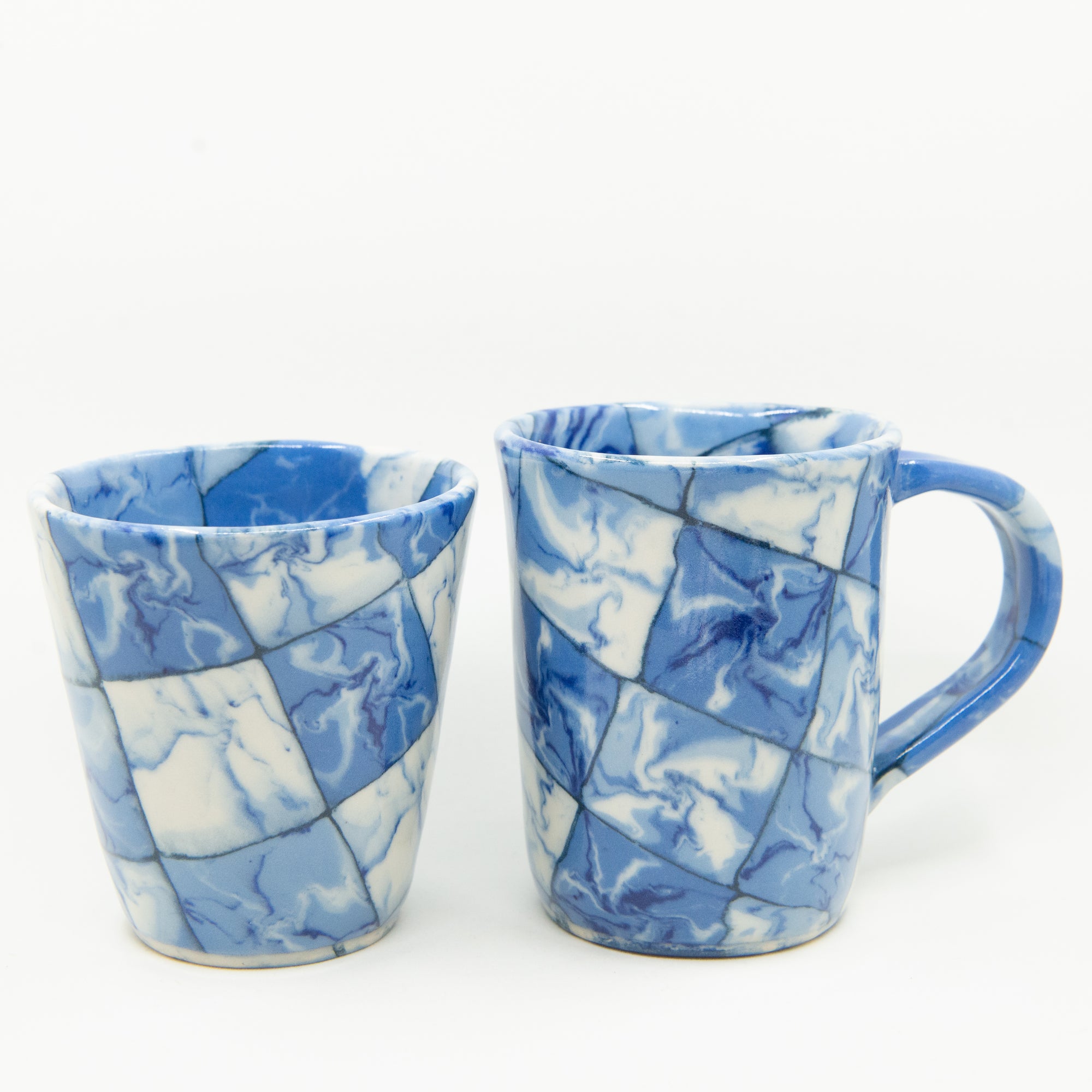 Handmade blue and white patterned cup and mug. 