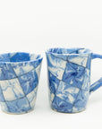 Handmade blue and white patterned cup and mug. 