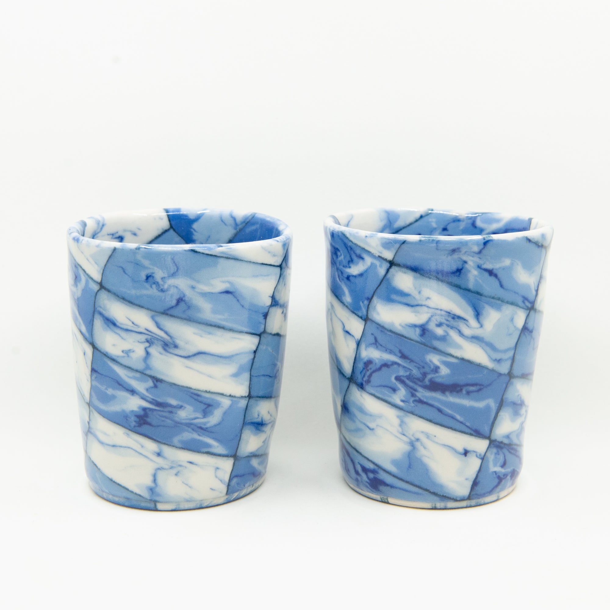 Handmade blue and white patterned cups.