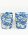 Handmade blue and white patterned cups.