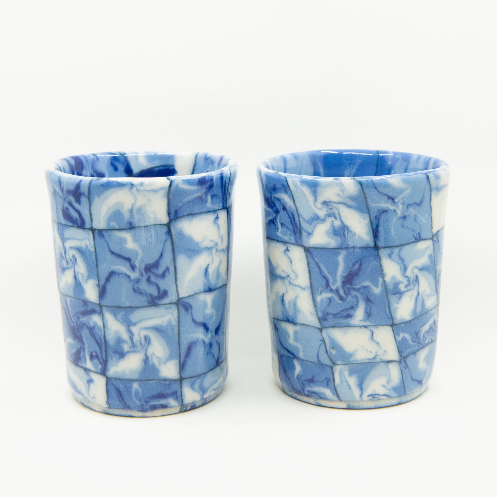 Handmade blue and white patterned cup and mug. 