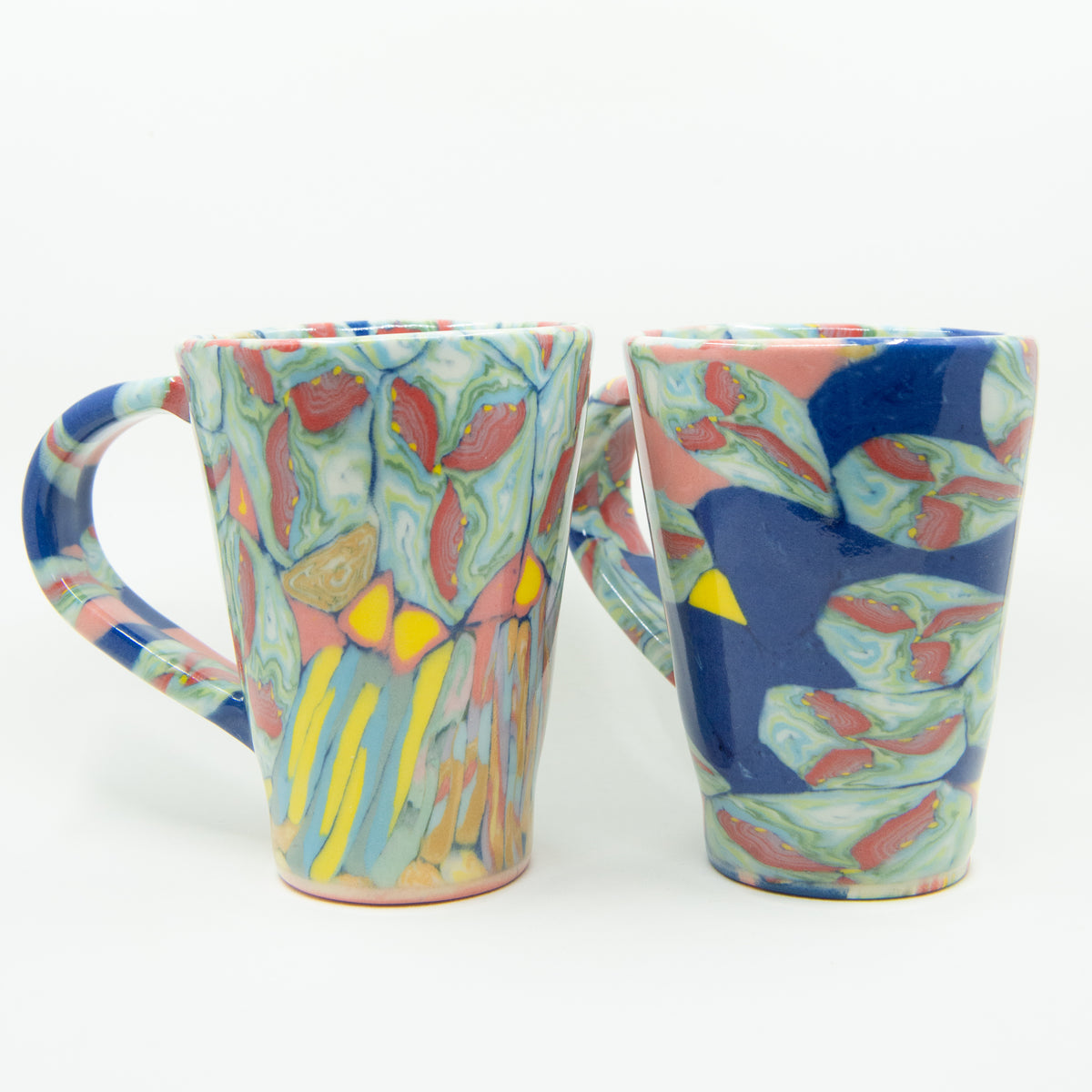 Video showing a colorful handmade cup from all angles.